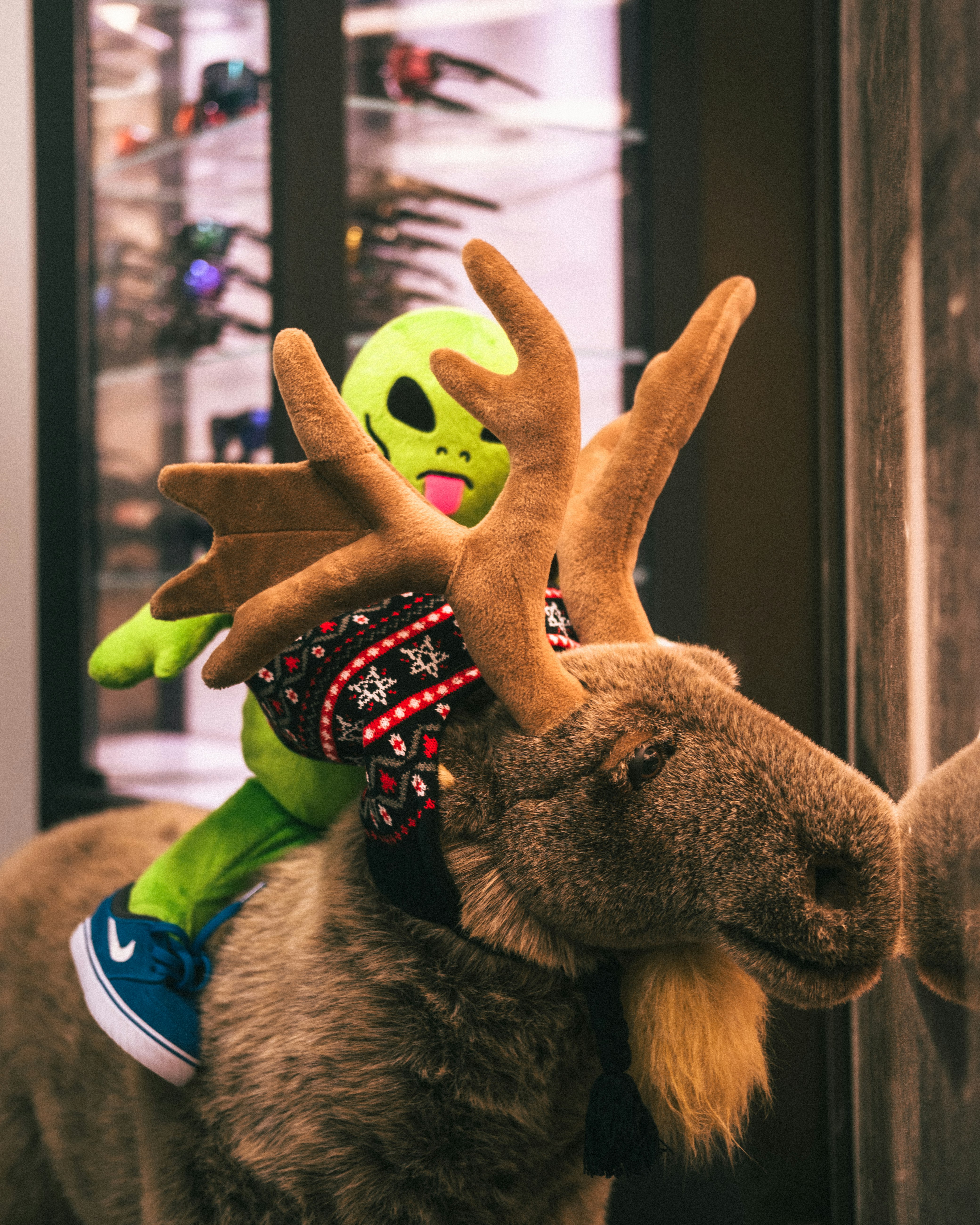 brown giraffe plush toy on window